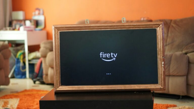 Fire TV loading screen displayed on a television inside a cozy living room